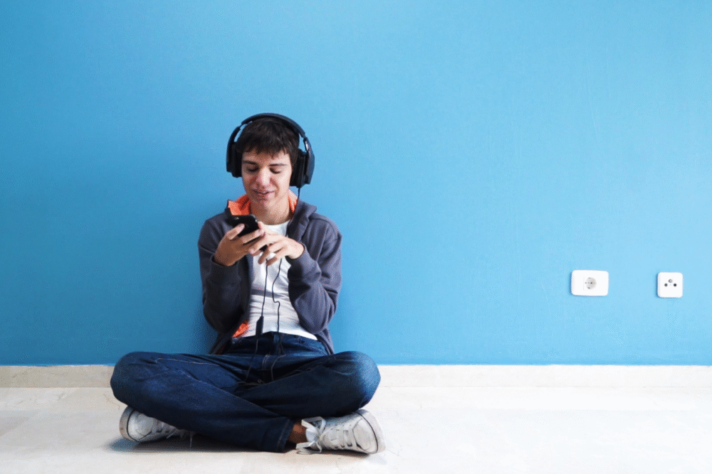 Autism, boy sitting with headphones on