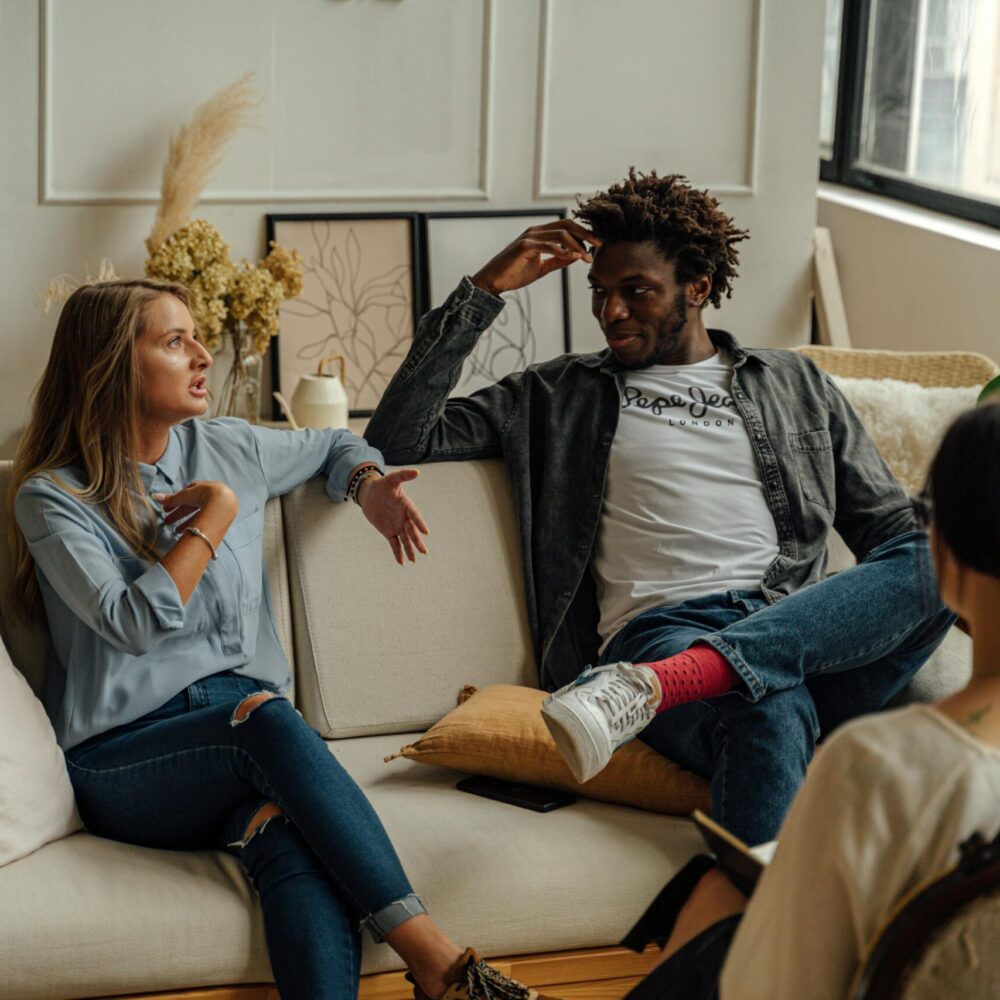 A man and a woman receiving couples therapy