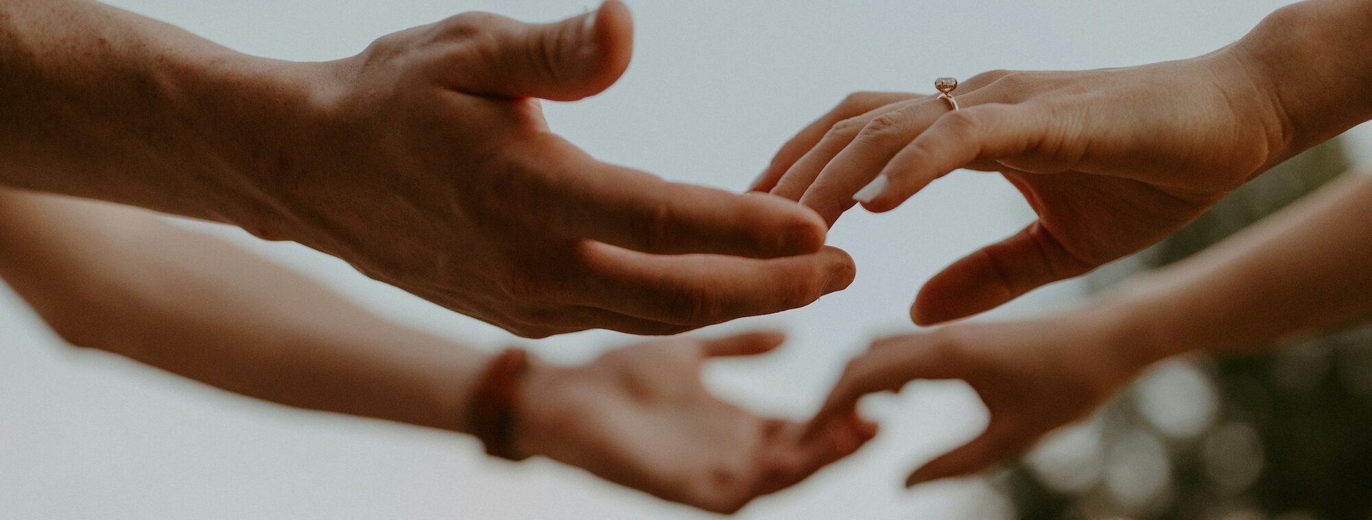 hands reaching for each other