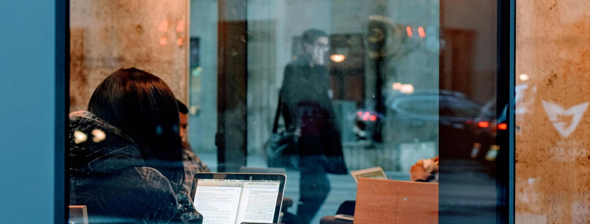A woman working through a window