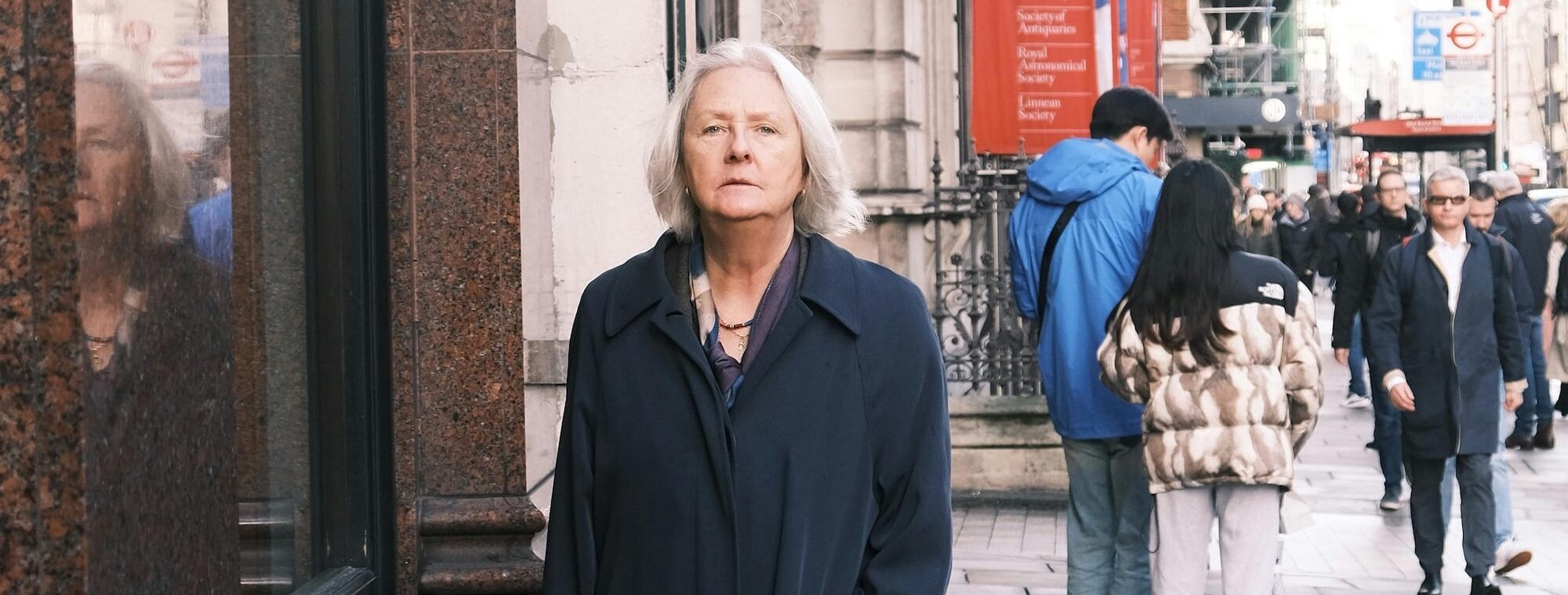 Woman walking alone down a street