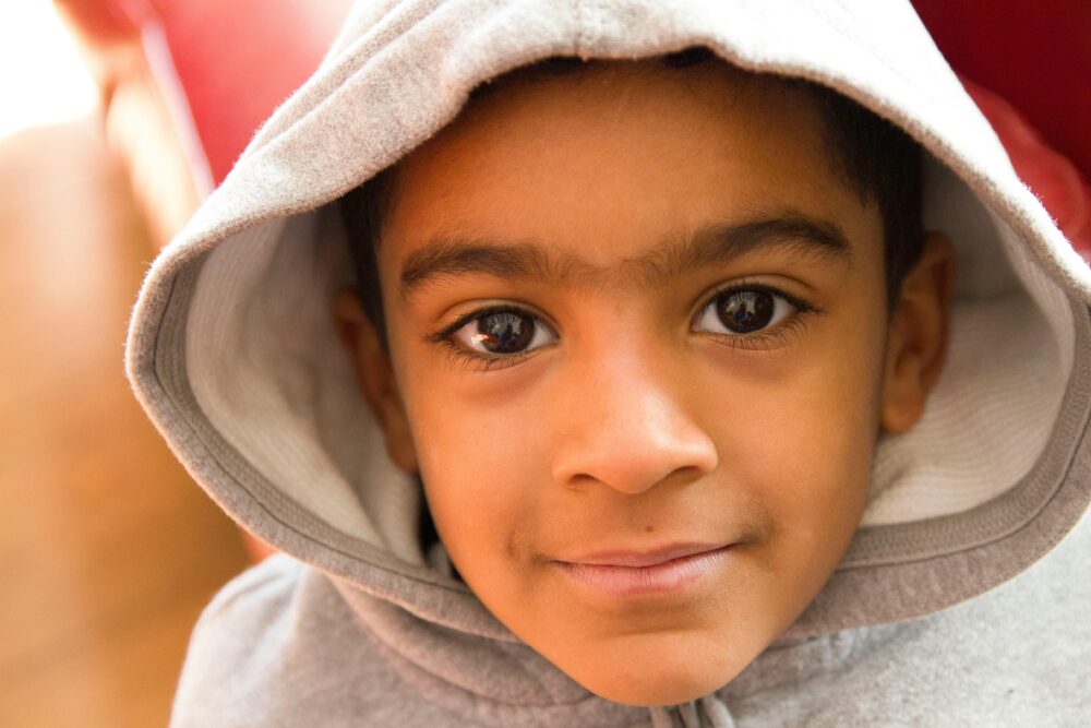 Close up of young boy looking into the camera