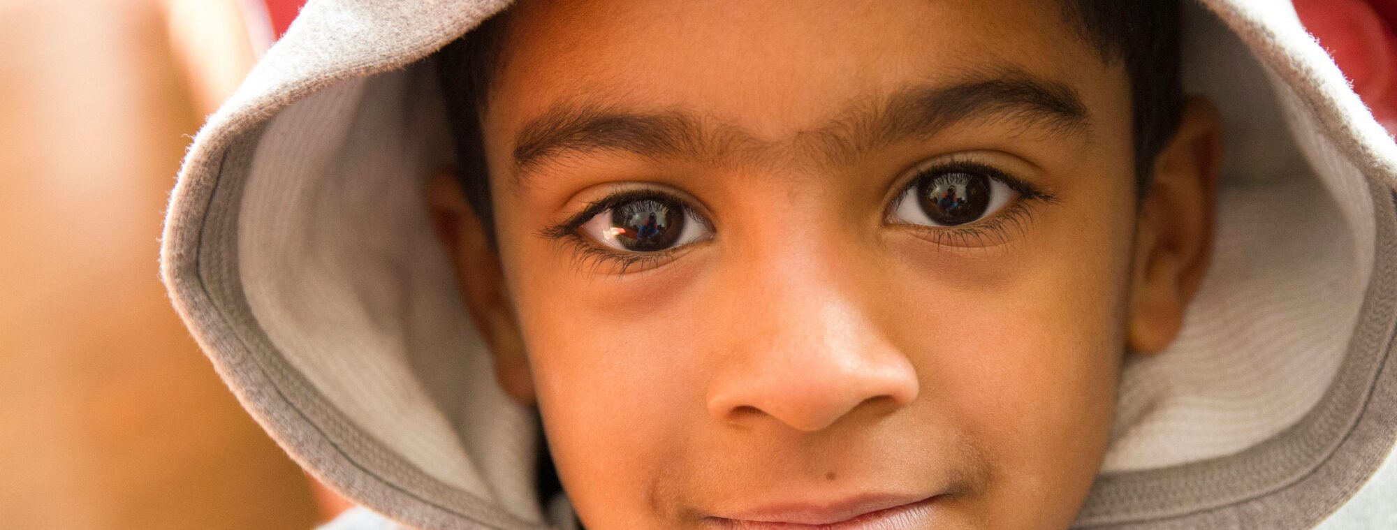 Close up of young boy looking into the camera